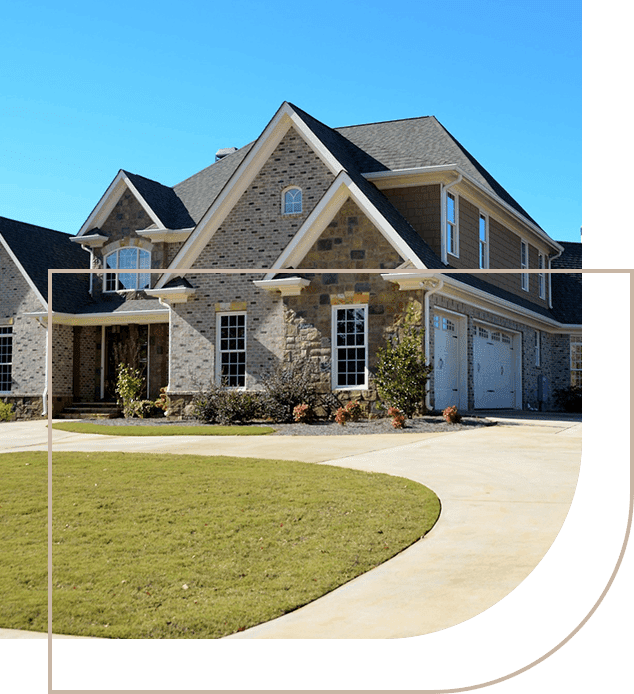 A large house with a lawn in front of it.